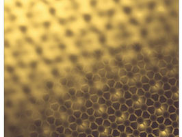 An intercrystal formed by overlaying twisted graphene on hexagonal boron nitride.