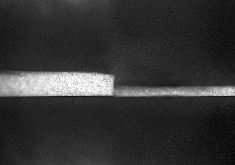 Purdue University researchers have created a new formula for the world's whitest paint, making it thinner and lighter. The previous iteration (left) required a layer 0.4 millimeters thick to achieve sub-ambient radiant cooling. The new formulation can achieve similar cooling with a layer just 0.15 millimeters thick. This is thin and light enough for its radiant cooling effects to be applied to vehicles like cars, trains and airplanes. @ Purdue University/Andrea Felicelli