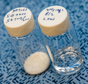 Ammonium chloride, at left, and liquid ammonia are the products of a catalyst developed by engineers at Rice University to convert wastewater into useful chemicals. @ Jeff Fitlow