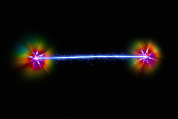 Figure 1: Conceptual artwork depicting a pair of entangled quantum particles. Two researchers have now developed an exact mathematical expression for the important process of entanglement distillation. @ VICTOR DE SCHWANBERG/SCIENCE PHOTO LIBRARY
