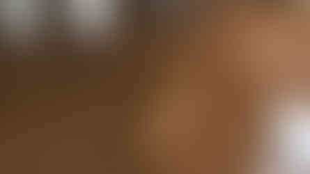 Metallic epoxy concrete floor in bronze tones for a modern, high-end interior space