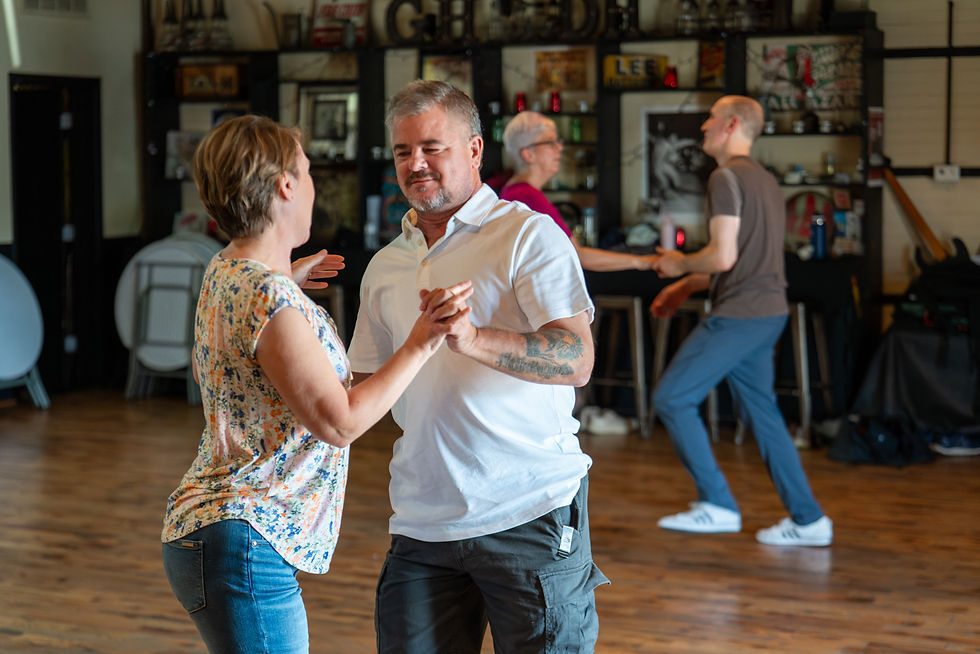 Couples enjoying learning swing dancing.