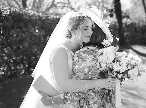 Bride and her mother in law having a warm embrace..JPG