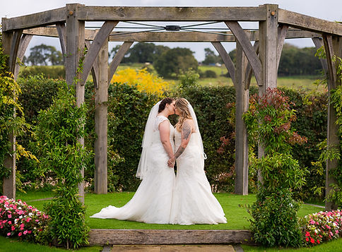 Bride and bride sharing an intimate kiss. Selden Barns wedding venue..JPG