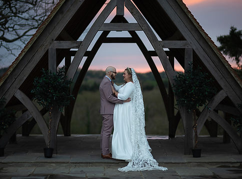 Bride and groom holding a warm embrace. Highley Manor wedding venue..JPG