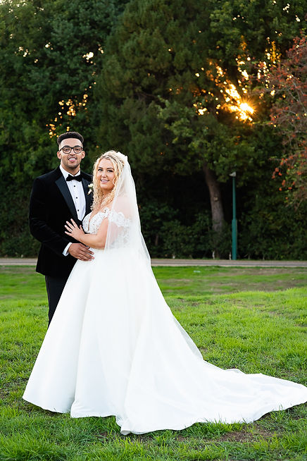 Bride and groom hand in hand posing for a photo at Gaynes Park wedding venue..JPG