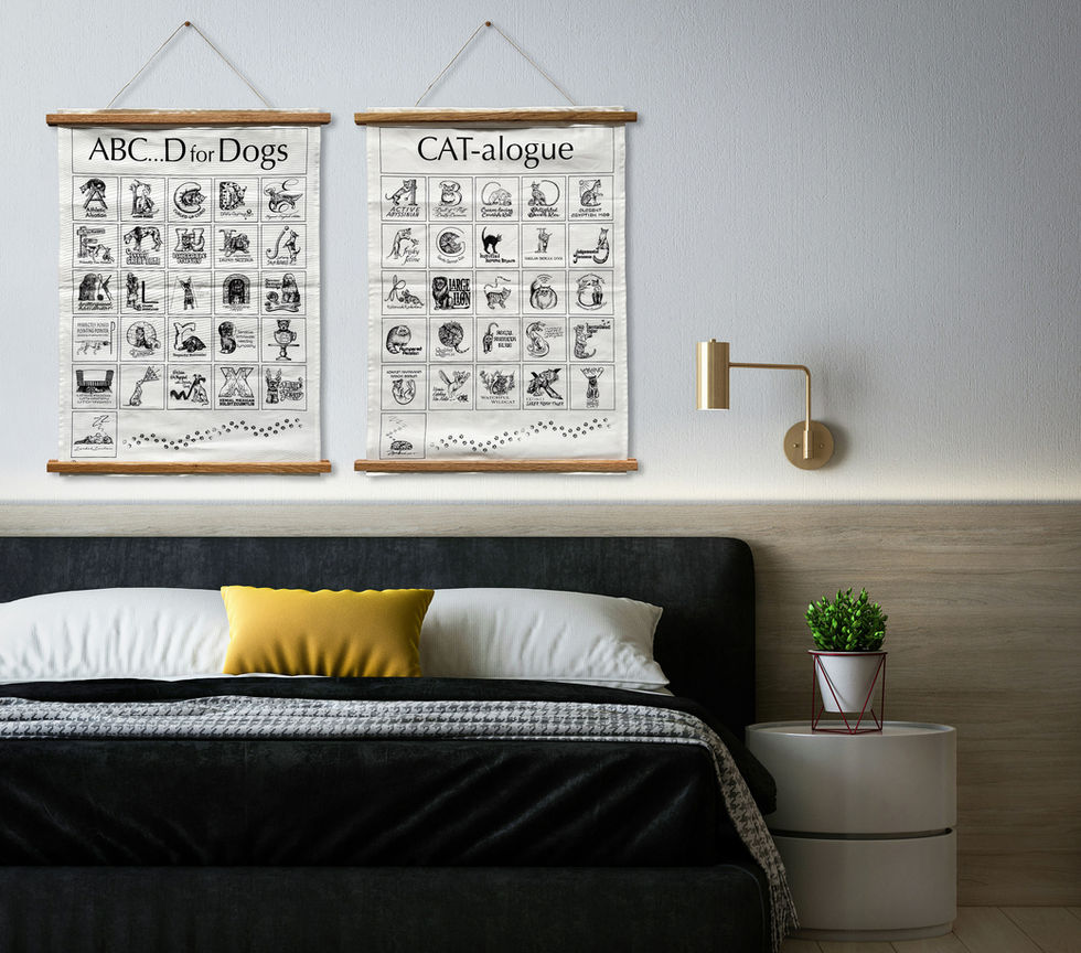 Bedroom with cat and dog themed wall art above the bed.