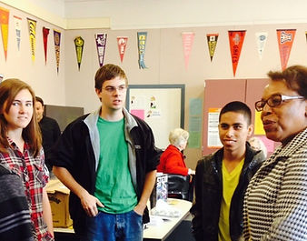 A judge holding conversation with students.