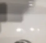 This is a close up photo of what is referred to as "crazing" in an expensive fireclay sink!