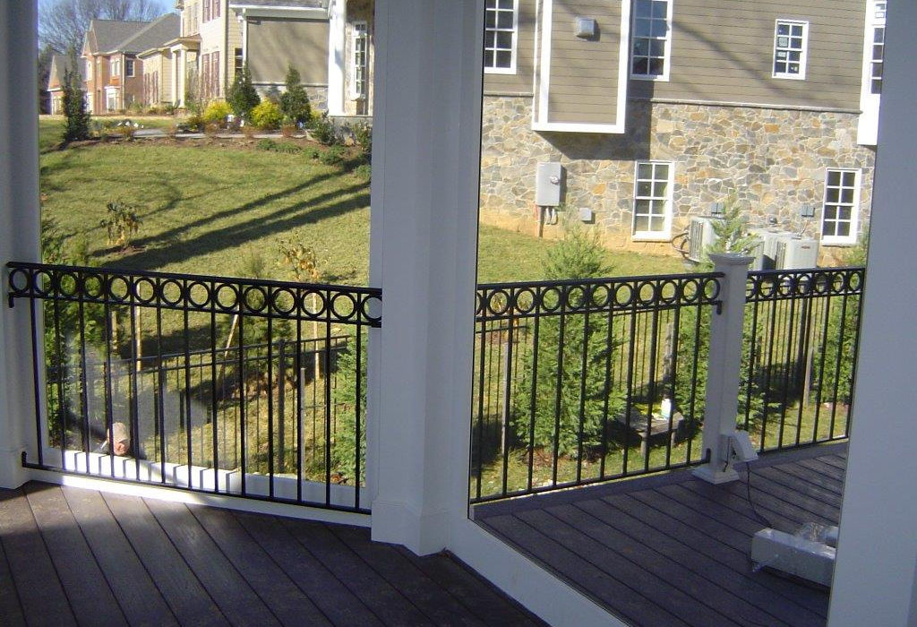Residential deck with ornate black railing