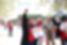 Union power protest: Woman raises fist, holding sign