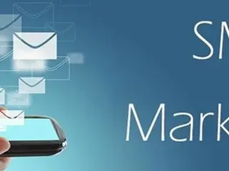 "Cell phone store employee sending marketing text message to customers using SMS platform