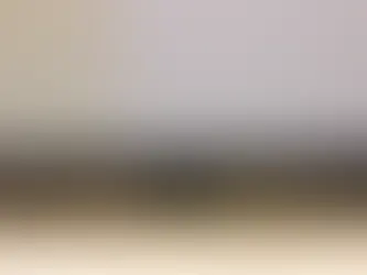 Technician testing smartphone speaker and microphone functions before quoting a repair"