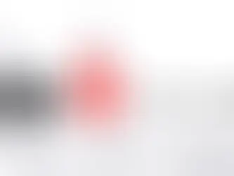 Cell phone store owner reviewing Yelp listing and responding to customer reviews on a laptop