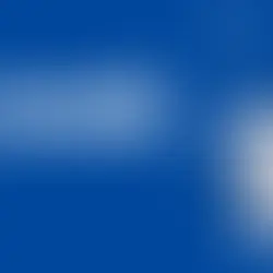 Cell phone store owner creating Facebook ad campaign on laptop for wireless retail promotion