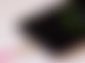 Technician diagnosing Android phone charging port problems with repair tools