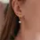 Thumbnail: Small Hoop Earrings with Mother-Of-Pearl Clover Pendant - Victoire Collection