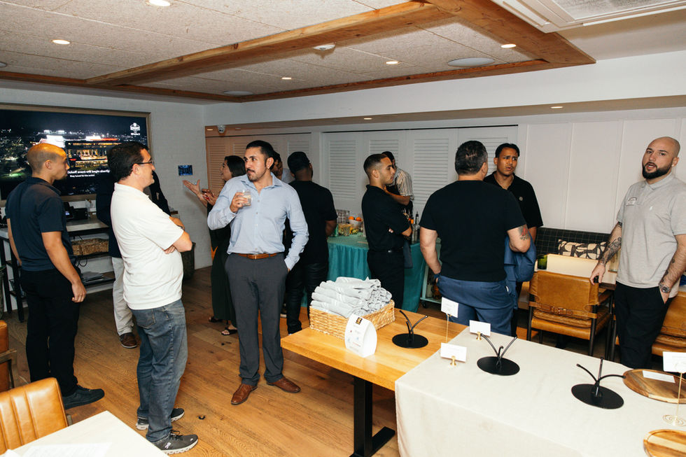 Group of people socializing in a room.