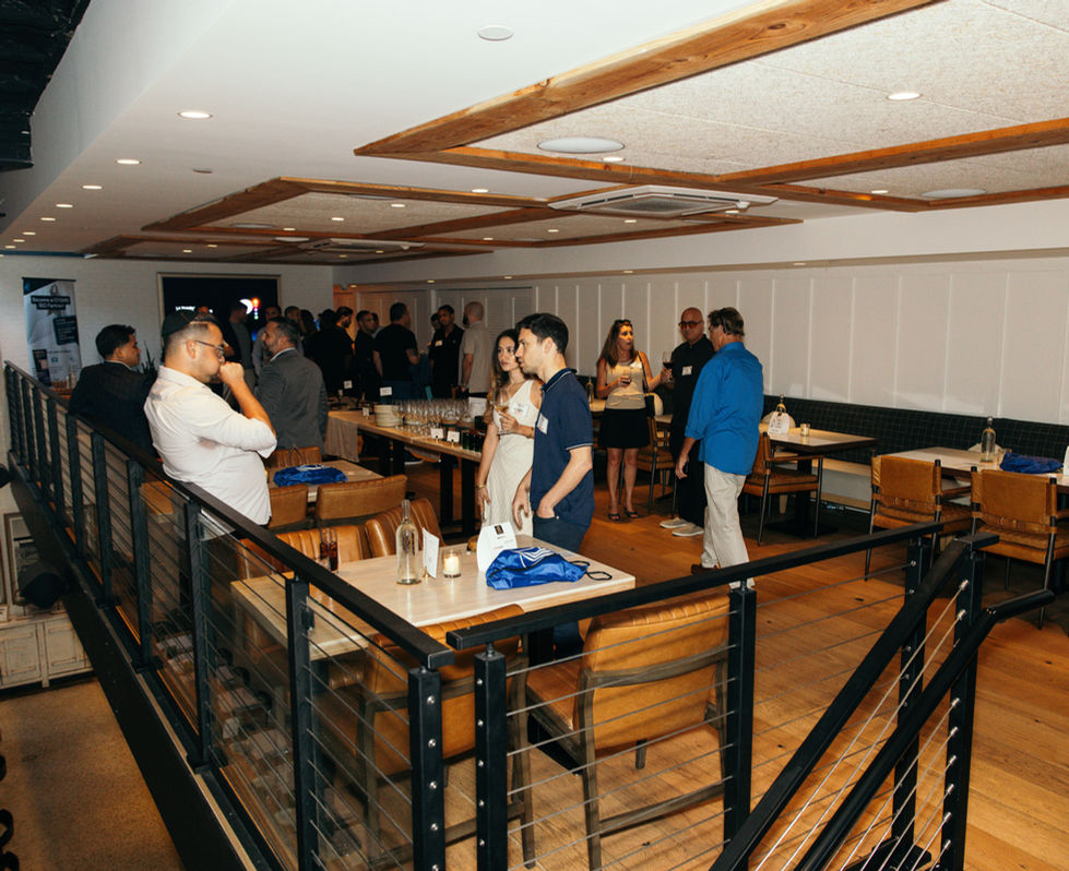 People socializing in a modern indoor setting.
