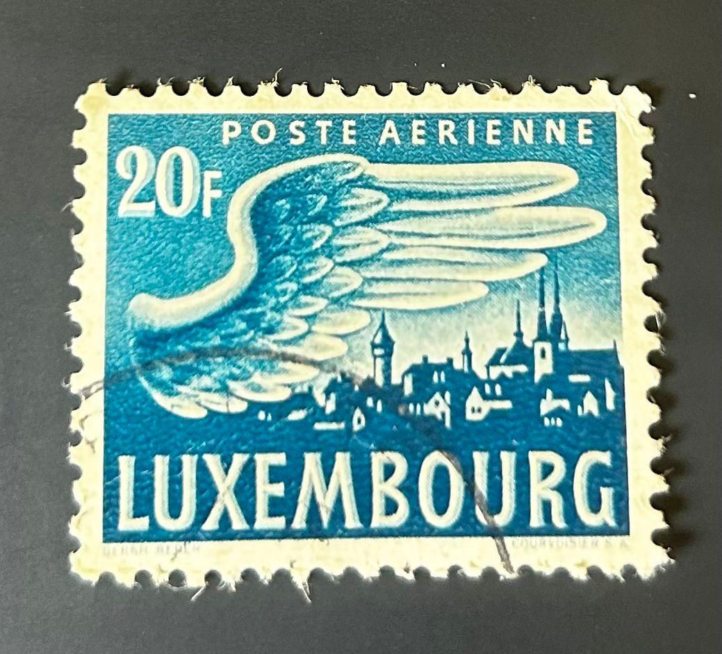 P166-Luxembourg 20F Airmail Stamp "Poste Aerienne Wing Over City" Blue – Used