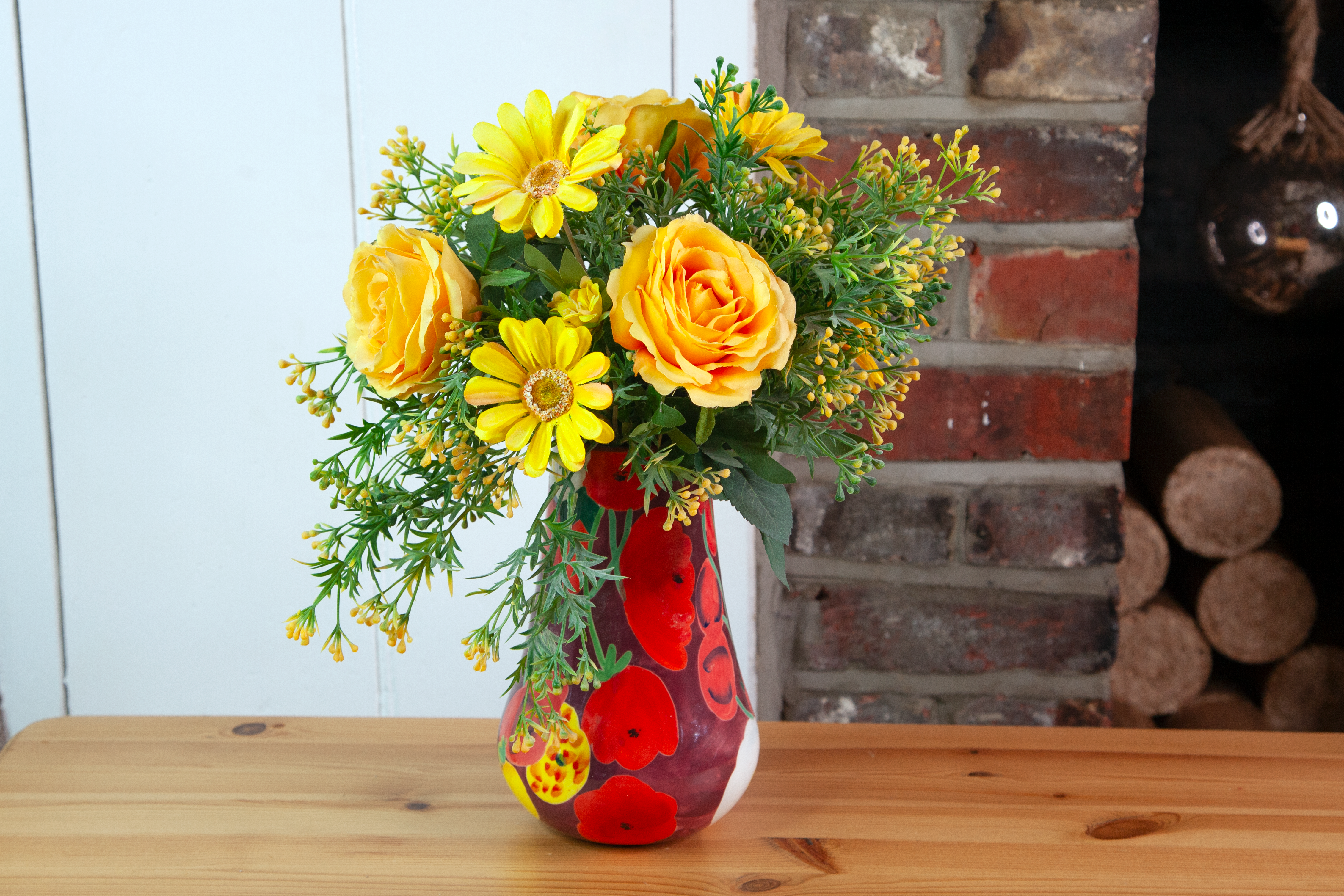 Roses, Gerbera and Berry in a bold glazed vase