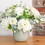 Thumbnail: Roses, Ranunculus and Eucalyptus in a soft green vase
