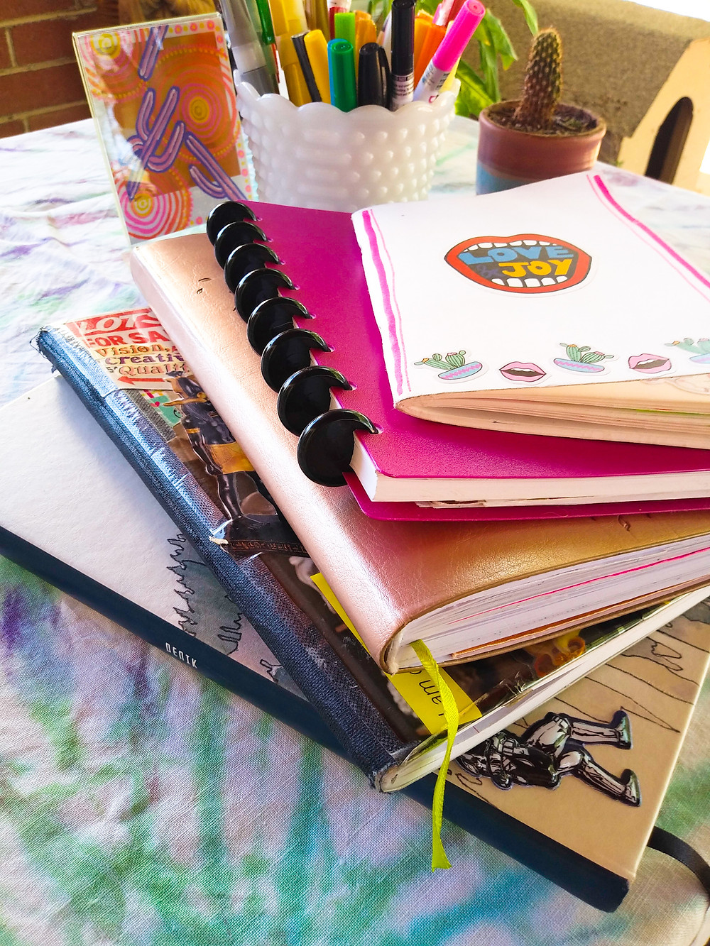 Journals, notebooks and sketchbooks used daily for organizing and managing life and work.