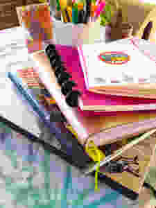 Journals, notebooks and sketchbooks used daily for organizing and managing life and work.