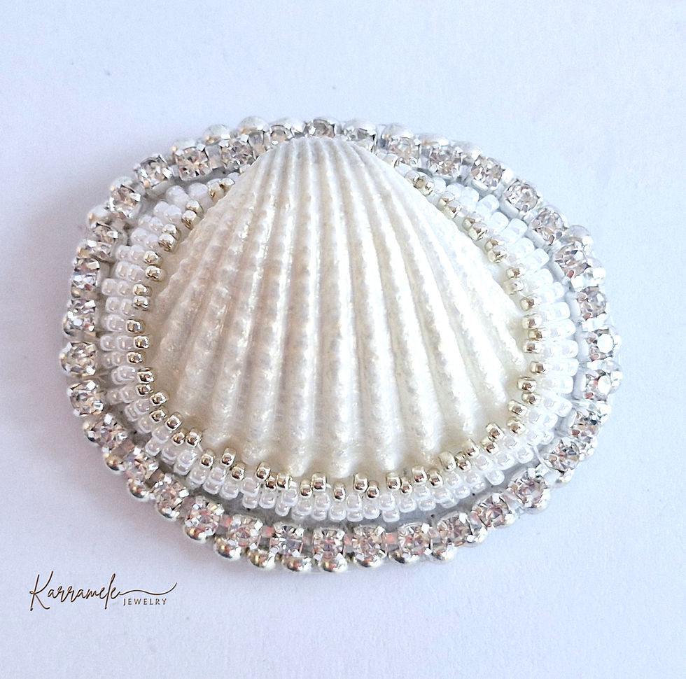 White seashell with rhinestone and pearl embellishments, Karramele design.