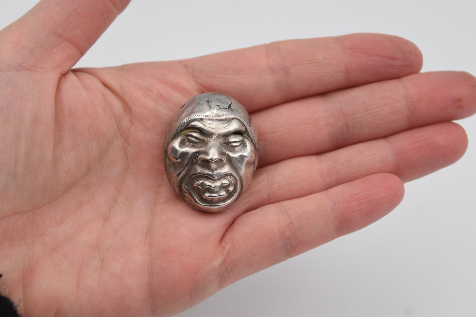 broche argent masque Noh style Behelit face
