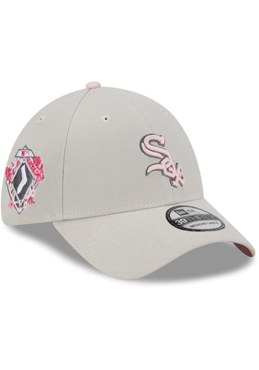 Chicago WHite Sox 2023 Mother's Day stretch cap. All stone color cap with primary team logo in pink with gray outline. Secondary team logo on right side with pink accent flowers.