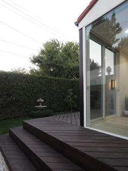 rear yard looking through master bedroom corner window