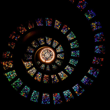 A%20spiralling%20stained%20glass%20window%20inside%20a%20chapel%20at%20Thanks-Giving%20Square%20in%2