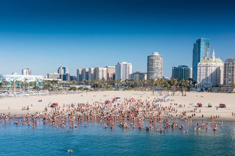 Hundreds of competitors run into the water for the beginning of the Irongurad event