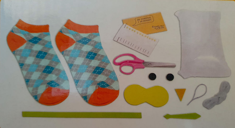 Thumbnail: Sew Cute Sock Owl kit components on a white surface.