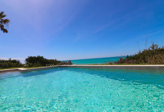 Infinity pool overlooking the beach and dunes.