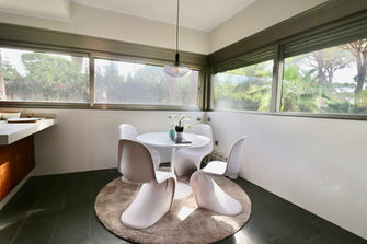 Breakfast nook with round table and wide window
