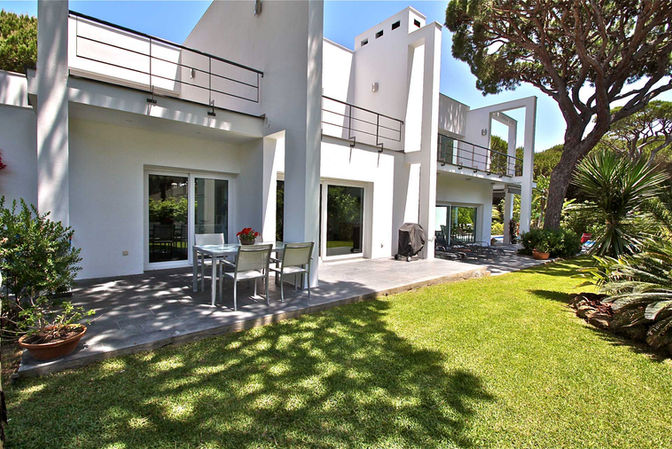 Covered terrace and balcony overlooking garden