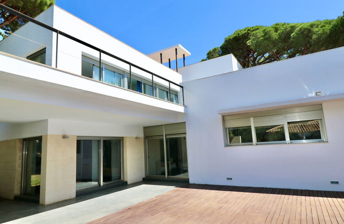 Side view of villa with terrace and garden