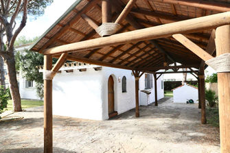 Covered carport and entrance area of villa