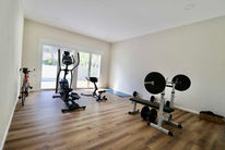 Home gym room with exercise equipment and window
