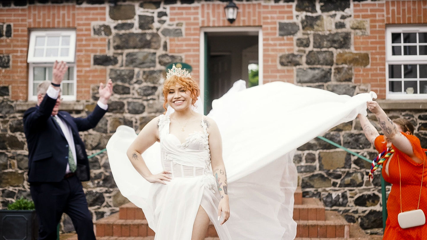 Entwined Wedding Videography Los Angeles CA Bride revealing wedding dress