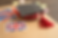 A graduation cap with a red tassel and a ribbon that says 'Congratulations,' placed on a surface featuring the Union Jack flag and a small British flag sticker, surrounded by colorful sticky notes.