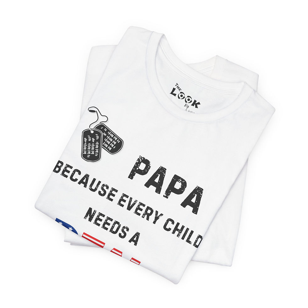 Thumbnail: Folded white shirt mockup showing Papa Real Hero graphic with dog tags and boots