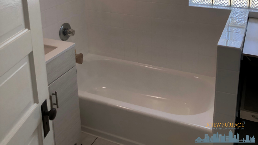 A photo showing a beautiful bathtub and tile refinishing project in Covington, KY completed by Anew Surface.