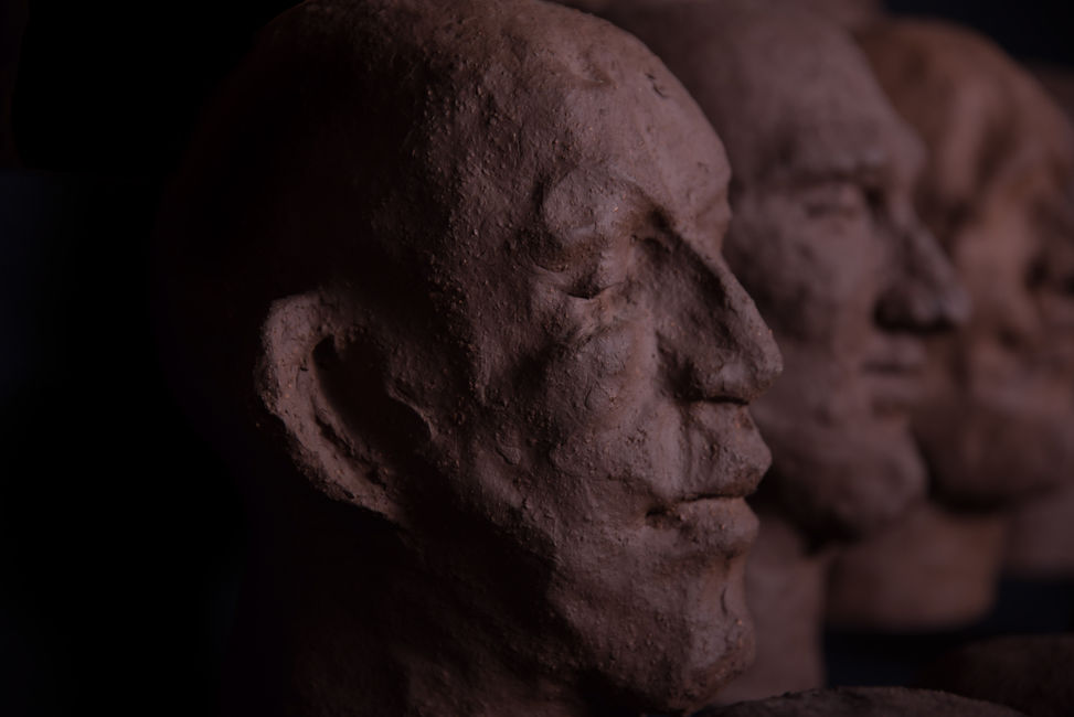 Groep of 14 dark terracotta biscuit sculpture by Louise Blankevoort