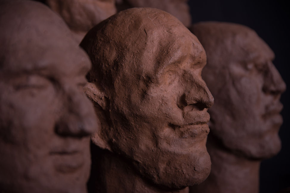 Groep of 14 dark terracotta biscuit sculpture by Louise Blankevoort