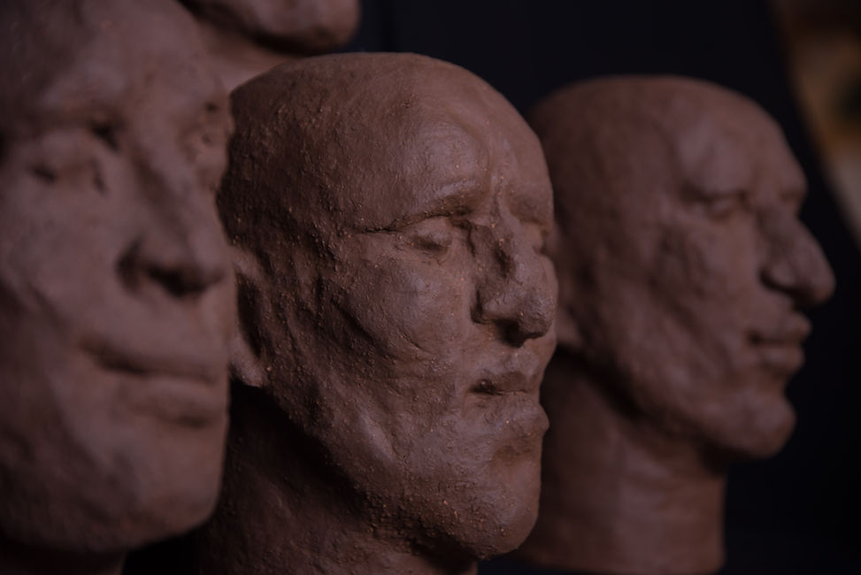 Groep of 14 dark terracotta biscuit sculpture by Louise Blankevoort