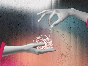 A pair of hands untangling a piece of string
