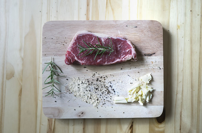Raw Beef on Wooden Plate